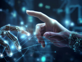 Symbolbild "Mensch-Roboter-KI-Interaktion". Roboterhand und Menschenhand interagieren. Das bild wurde erstellt mit generativer AI. Copyright: Jenny Sturm - stock.adobe.com