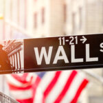 Wall Street in New York City at sunset