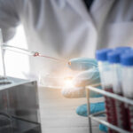 lab technician assistant analyzing a blood sample in test tube at laboratory. Medical, pharmaceutical and scientific research and development concept. Copyright: totojang1977 - stock.adobe.com