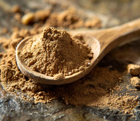 Mealworm powders on an old spoon on an olive stone surface. Copyright: M;ichael - Generiert mit KI - stock.adobe.com