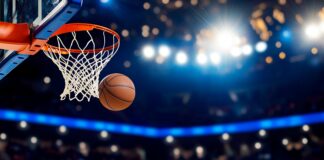 Basketball hoop and ball in the basket. Copyright: Sampa - stock.adobe.com